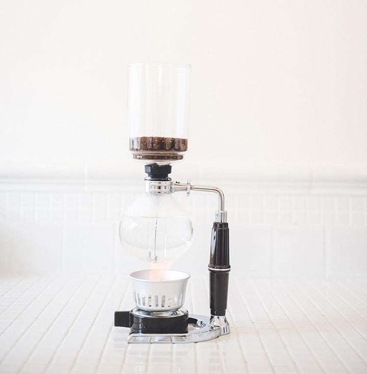 2 Cup Hario Technica Coffee Syphon on a white wooden surface with a white background