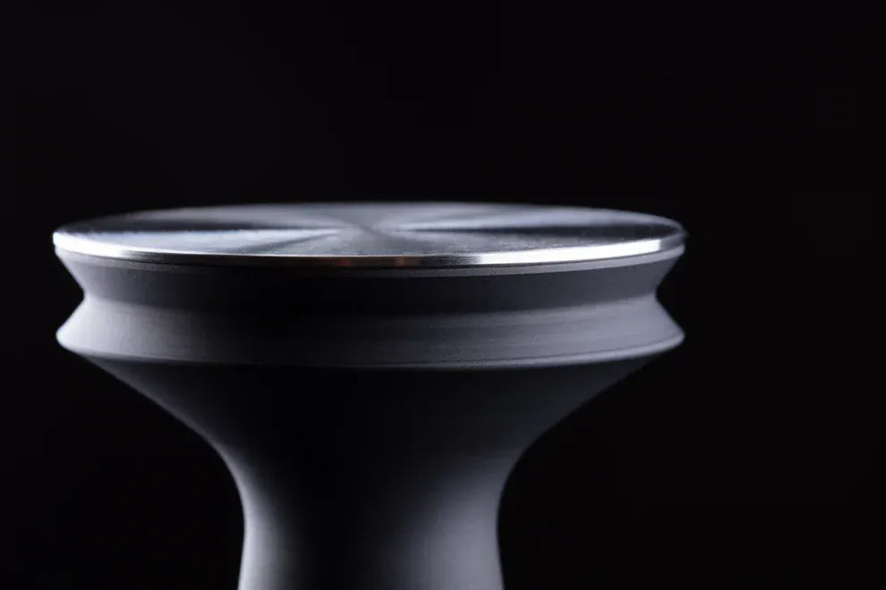 Barista Hustle coffee tamper featuring the double-flange design that eliminates vacuum