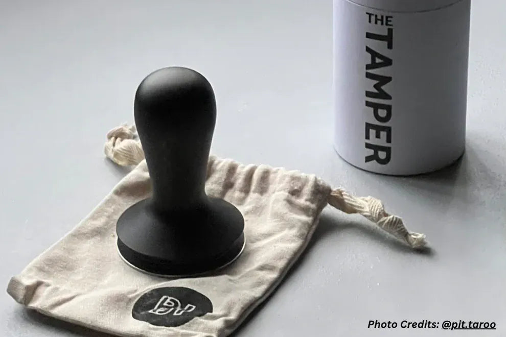 Barista Hustle coffee tamper with its branded cotton storage bag