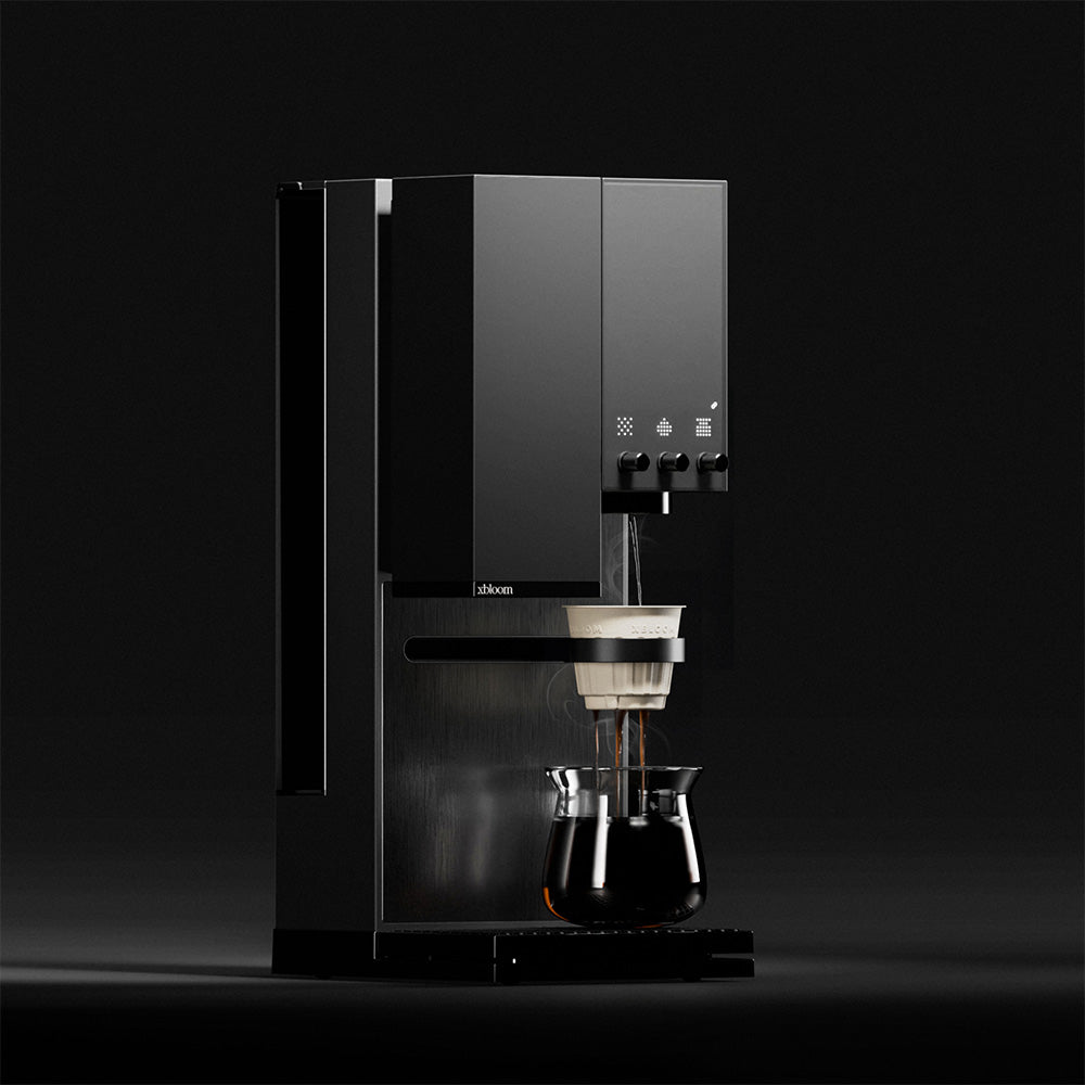 Midnight Black XBloom Studio Coffee Machine brewing a cup of coffee on a black background