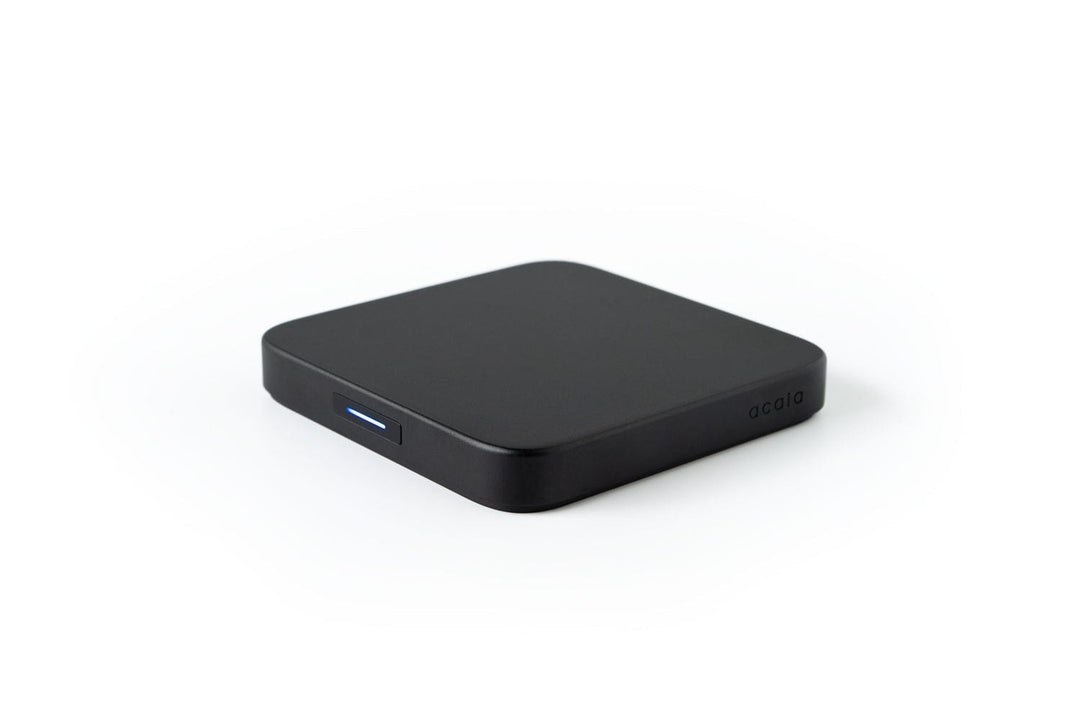 Acaia Umbra Lunar from above, showing its flat square top and USB-C charging port