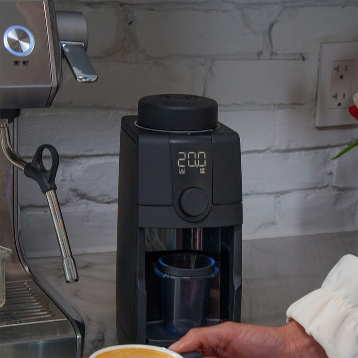 Baratza Encore ESP Pro Electric Coffee Grinder on a kitchen work top being used to make an espresso shot