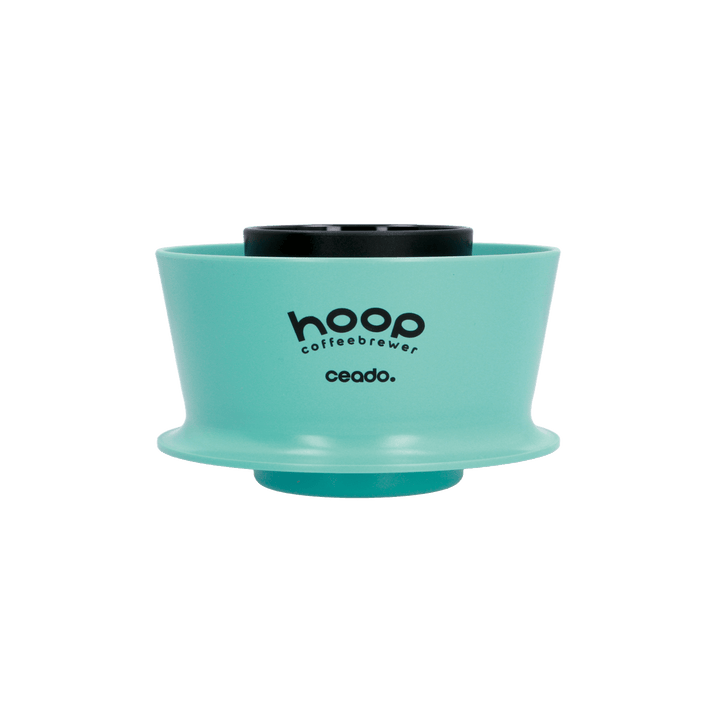 Front-facing product image of the Ceado Hoop Coffee Brewer in aquamarine, showcasing the cylindrical no-bypass design and minimalist construction