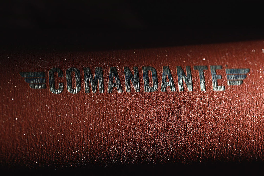 Close-up of a Comandante C40 Nitro Blade Coffee Grinder MK4 in Sunset with 'Comandante' branding.