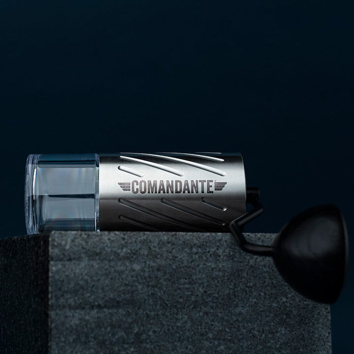 Comandante C60 Baracuda Coffee Grinder in Velvet Steel with 'Comandante' branding on a dark background