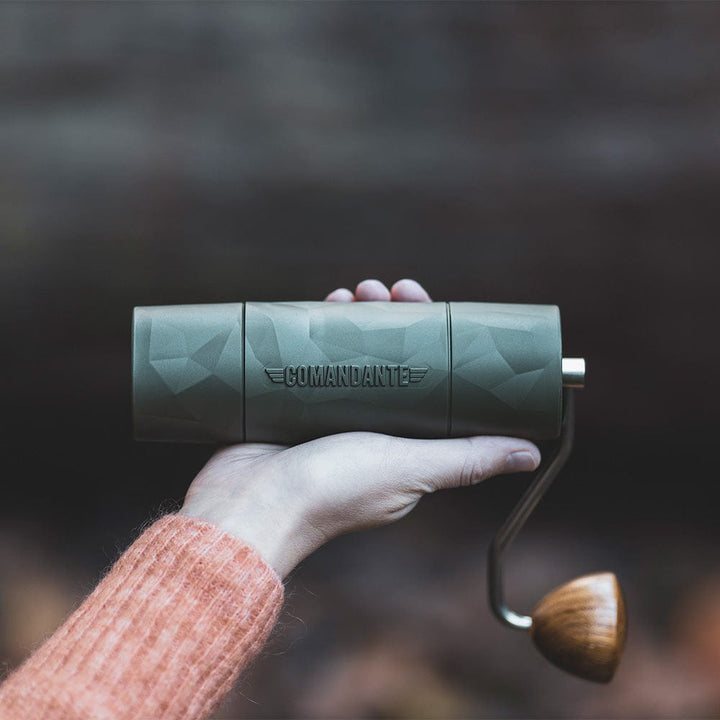 A Comandante X25 Trailmaster Manual Coffee Grinder in Forest Green