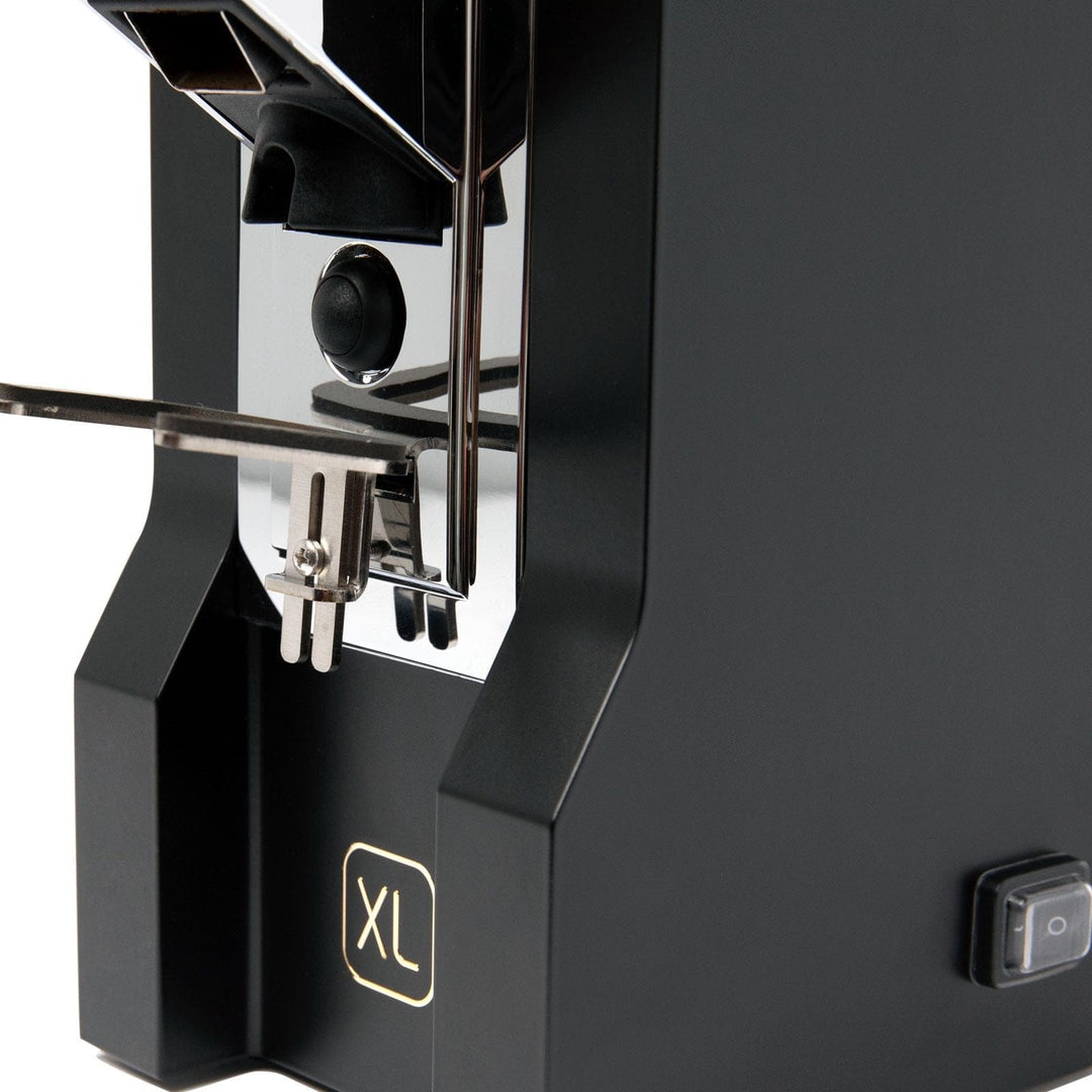 Close-up of the Mignon XL badge and rubber-coated portafilter fork
