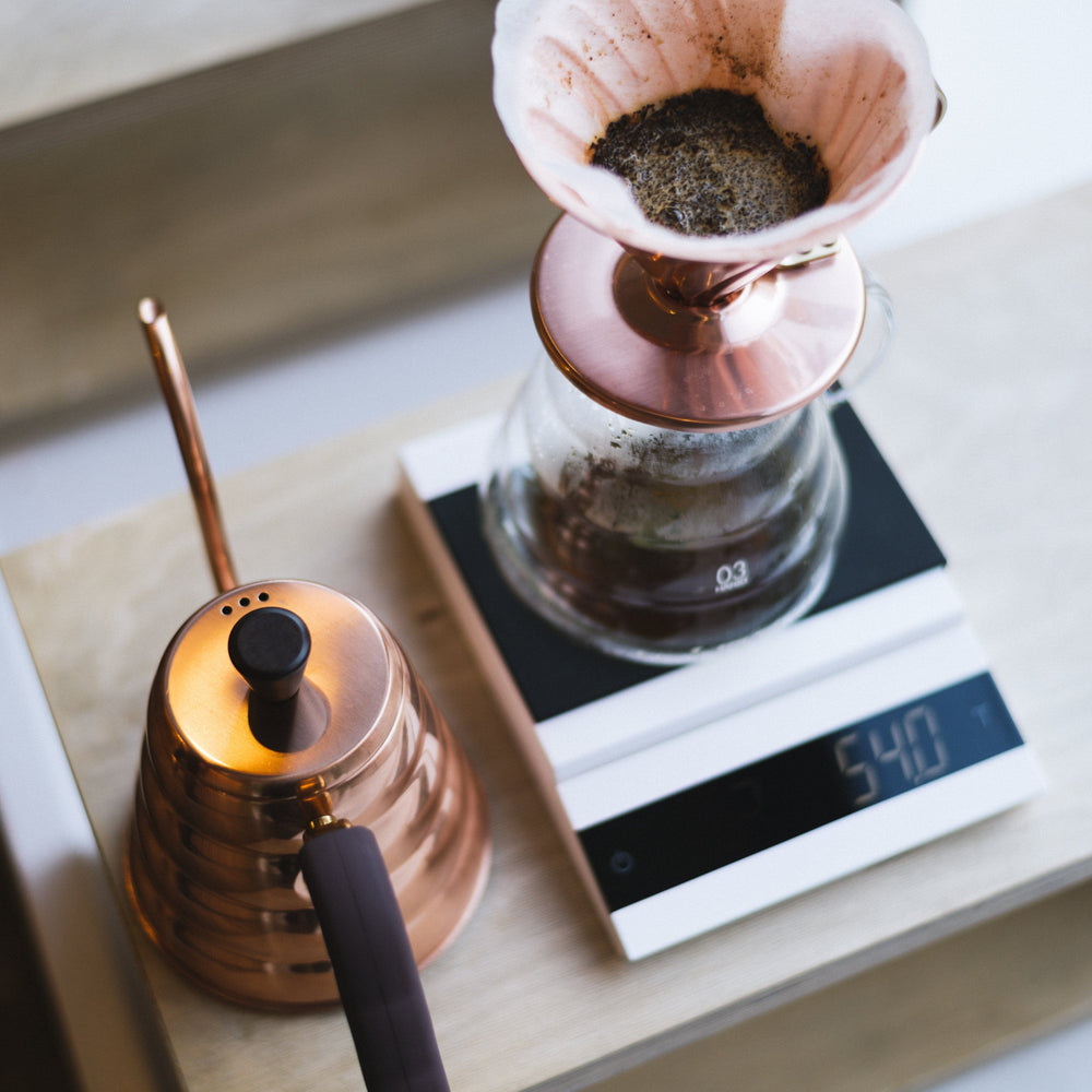 Coffee brewing setup with a pour-over coffee maker on a Felicita Parallel Coffee Scale in White