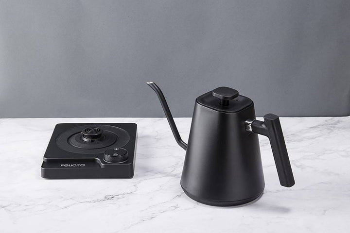 Felicita Square Temperature Control Electric Kettle on a marble surface with a grey background
