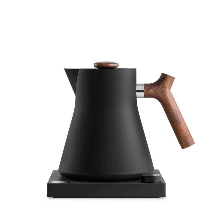 The Fellow Corvo EKG Electric Kettle in Matte Black and Walnut on a white background