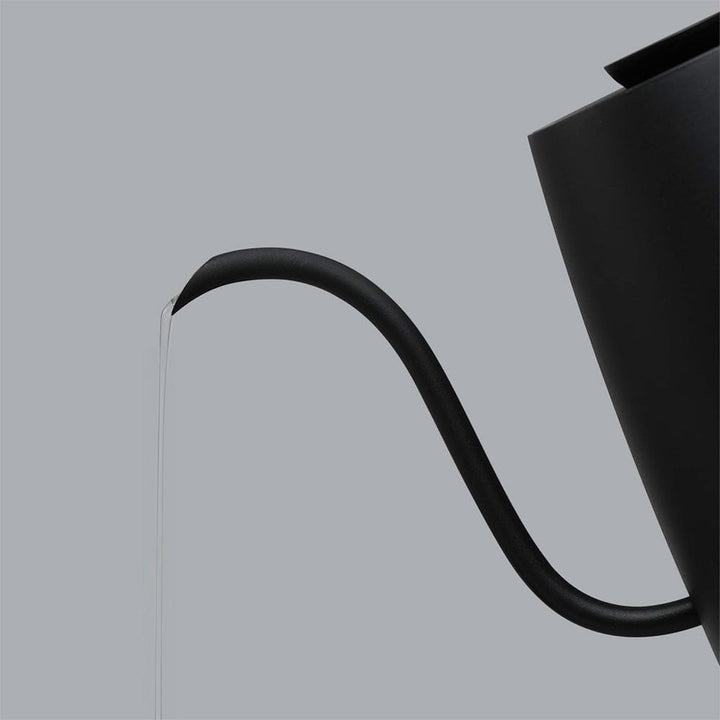 Black Hario Lyra kettle with a gooseneck spout on a grey background