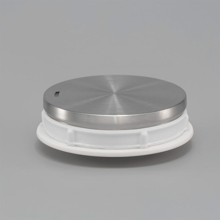 Hario Lyra lid on a grey background