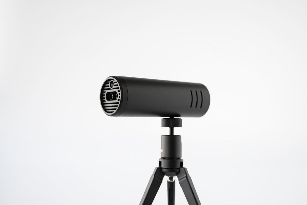 Acaia Ion Beam in Black mounted on a tripod via its 1/4-inch-20 thread, ion emitter facing forward