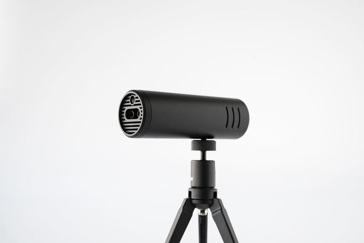 Acaia Ion Beam in Black mounted on a tripod via its 1/4-inch-20 thread, ion emitter facing forward