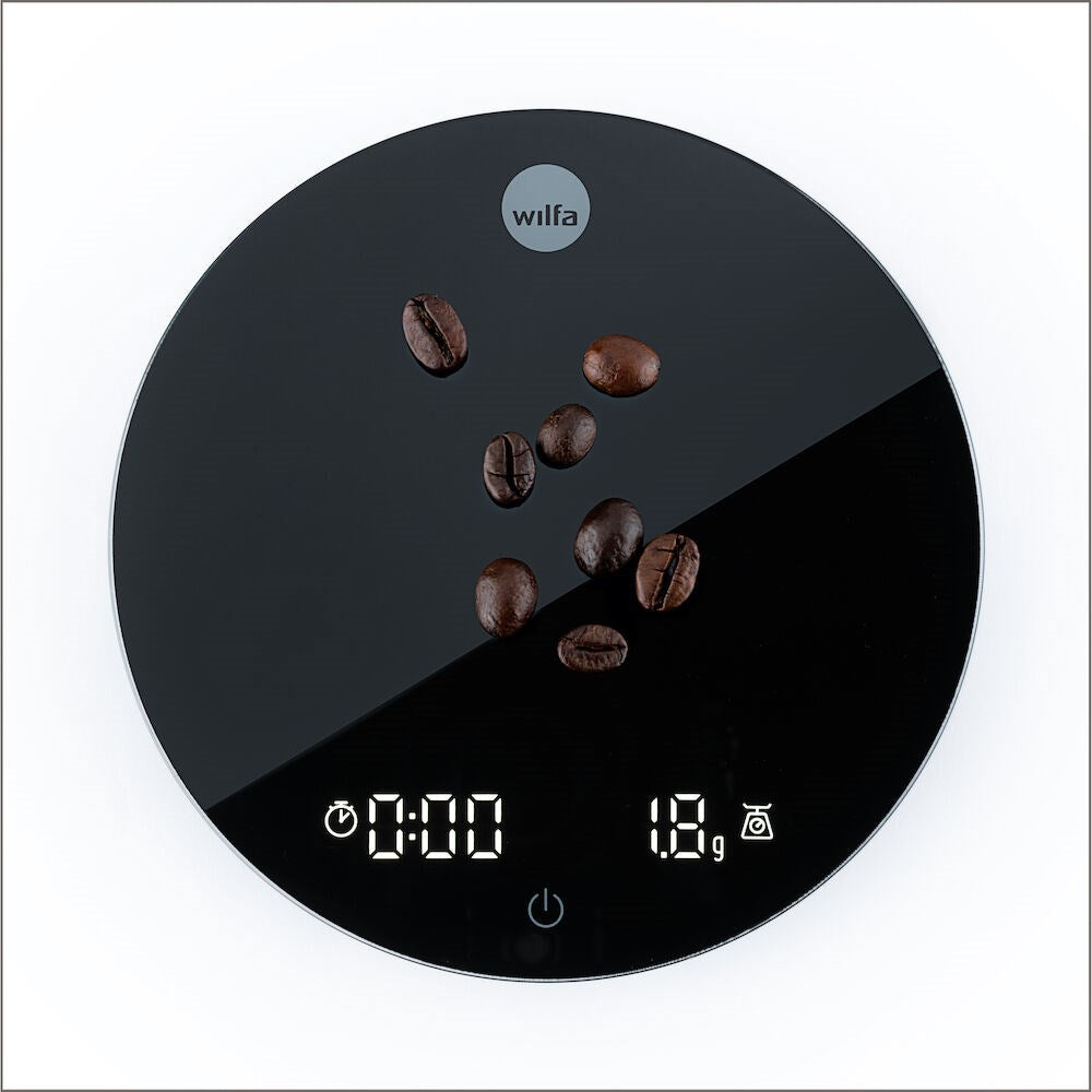 Digital Black Wilfa Uniform Coffee and Kitchen Scale with coffee beans on a white background