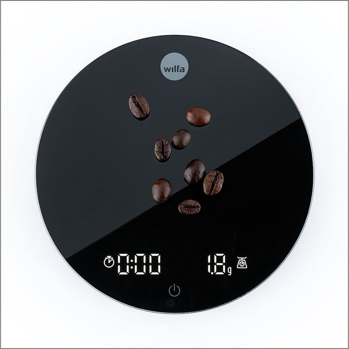 Digital Black Wilfa Uniform Coffee and Kitchen Scale with coffee beans on a white background
