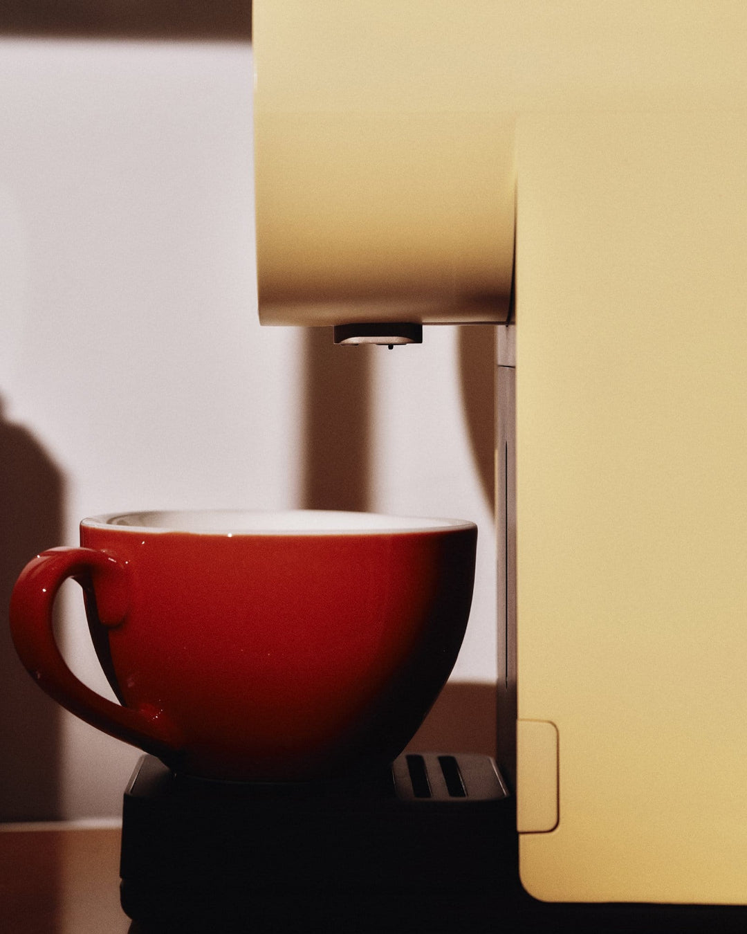 Morning Mini — Dawn, dispensing coffee into a cup