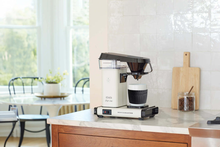 Moccamaster Cup One Coffee Brewer — Off-White brewing on a kitchen counter