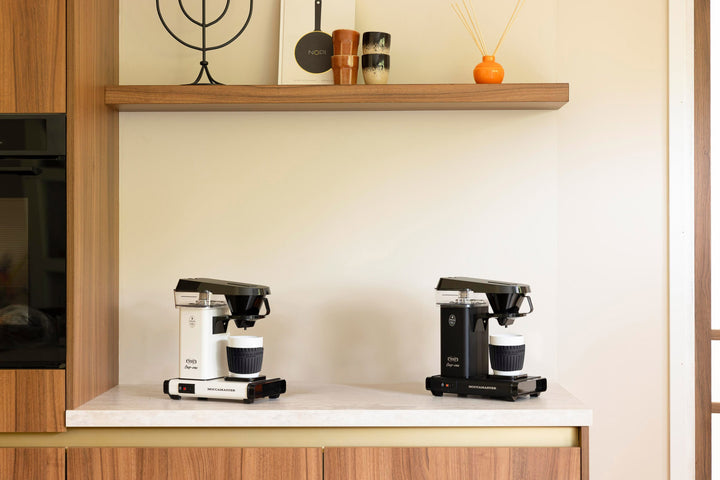 Moccamaster Cup One Coffee Brewer — Off-White and Matte Black side by side
