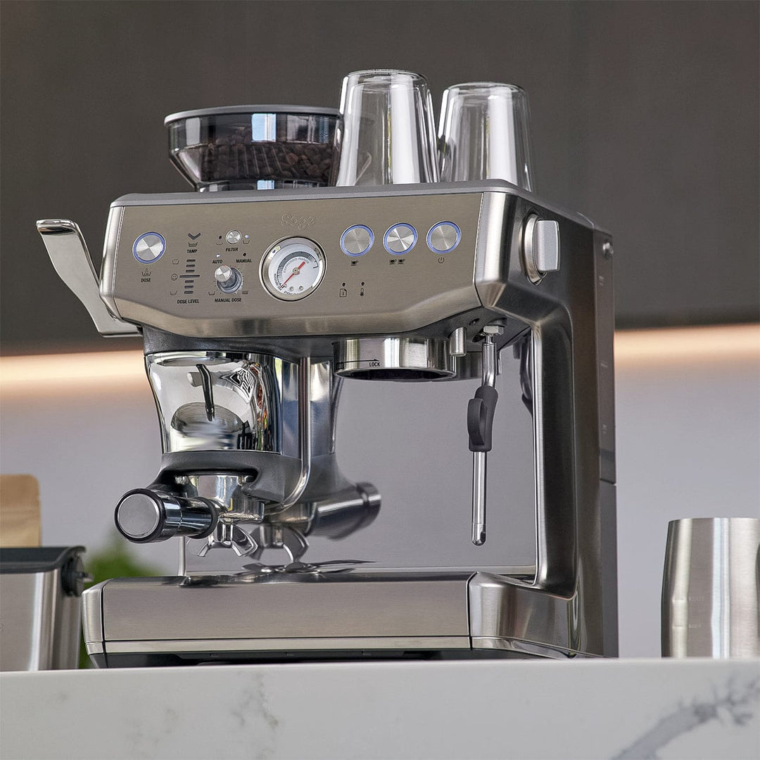 Stainless steel Sage Barista Express Impress Espresso Machine on a kitchen counter
