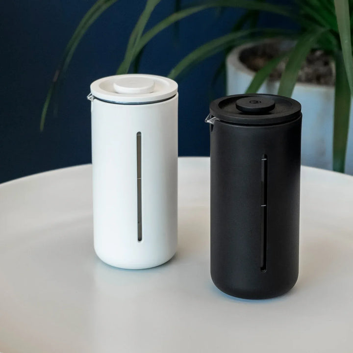Timemore U French Press in white and black side by side on a table