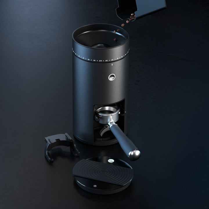 Wilfa Uniform Evo Electric Coffee Grinder with attachments on a dark background