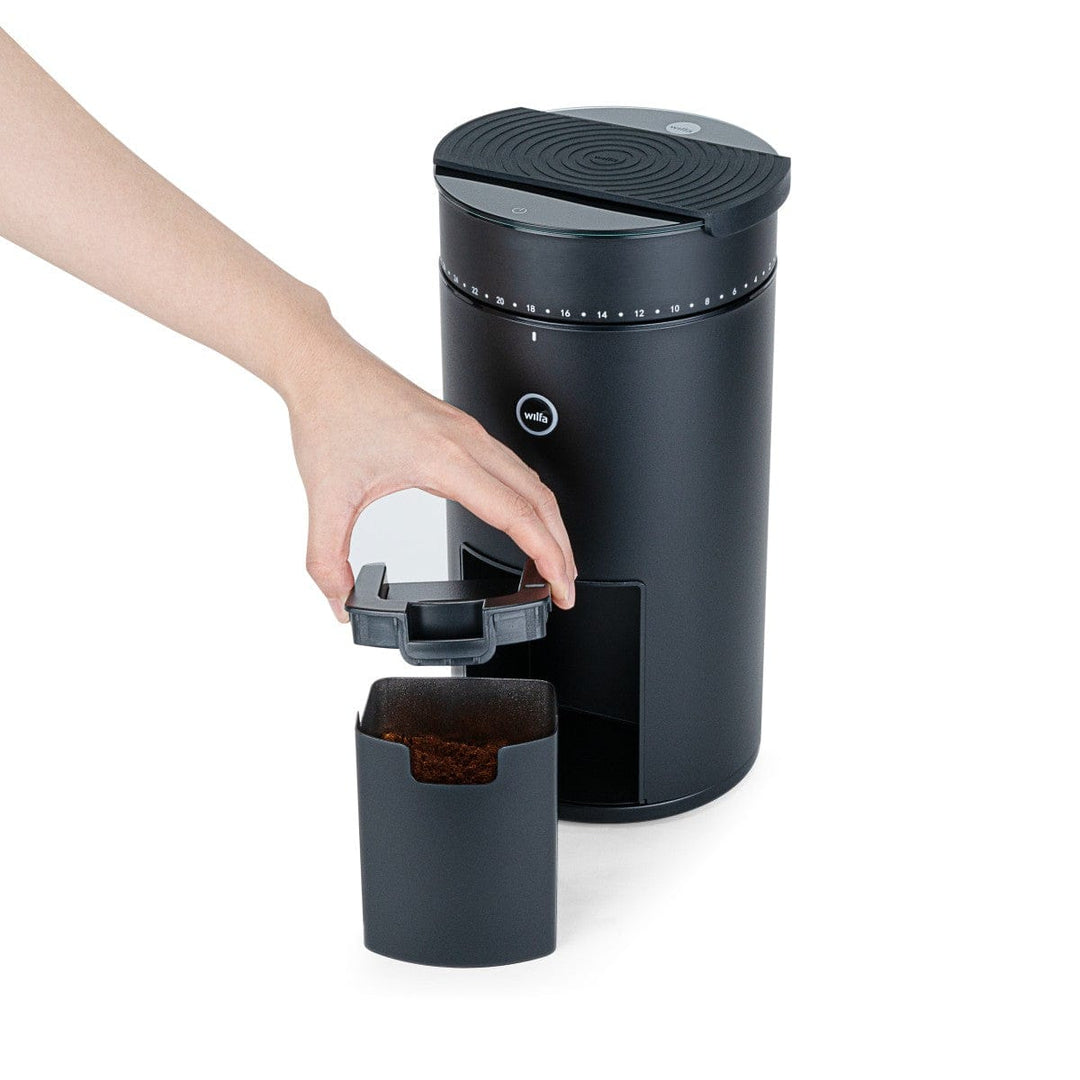 Wilfa Uniform Evo Coffee Grinder with grounds bin full of coffee